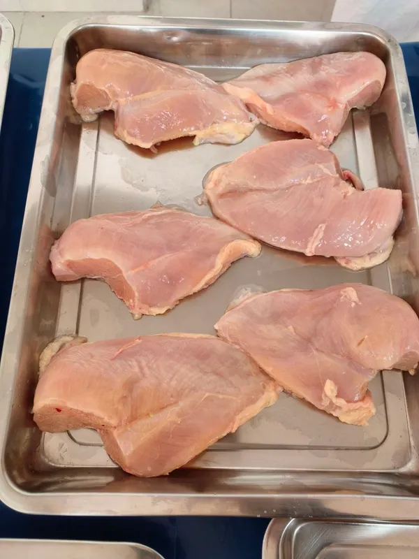 Frozen skinless boneless chicken breast, available in two grades 2