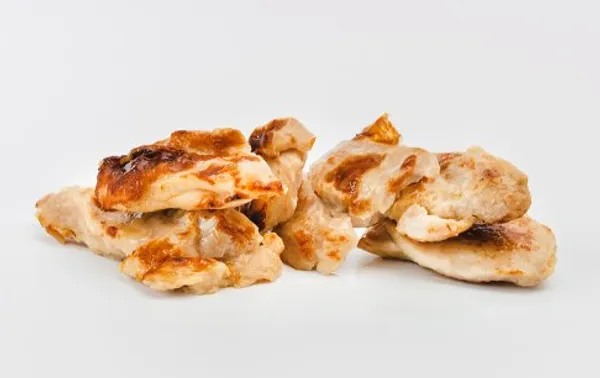 Roasted chicken leg meat pieces