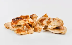 Roasted chicken leg meat pieces